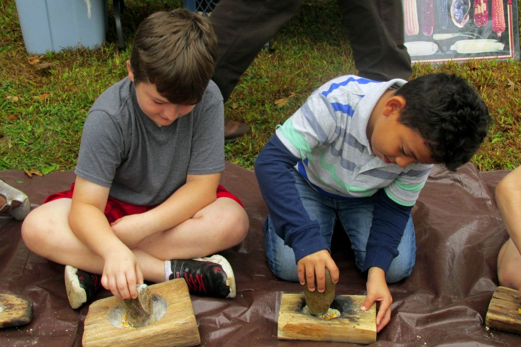 students with mortar and pestle